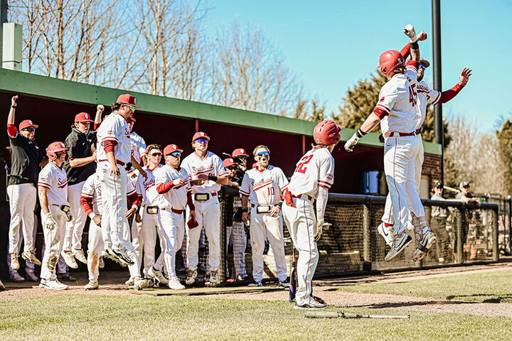 An IU Southeast baseball player celebrates on second base.